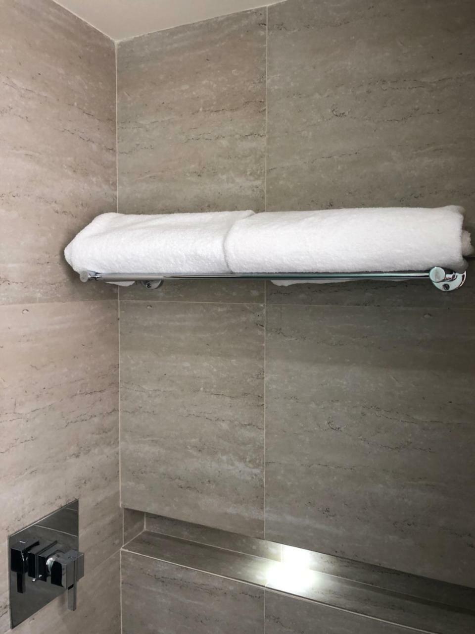 Mc Suites Mexico City Exterior photo A towel rack with a towel